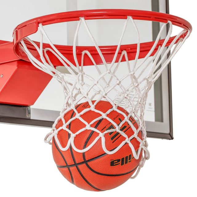 White nylon basketball net on a red rim with a ball dropping through
